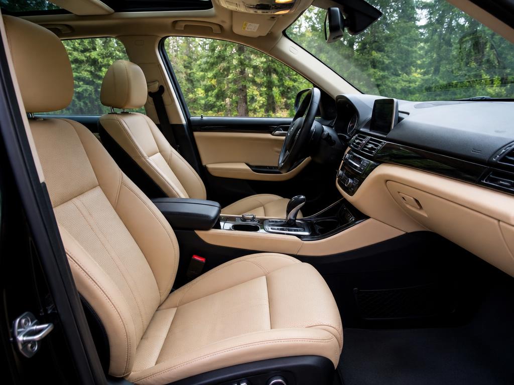 Spotless freshly detailed car interior with clean beige leather seats and a dust-free dashboard